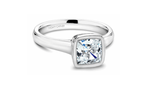 A white gold bezel-set engagement ring from Noam Carver, available at Adlers Jewelers.