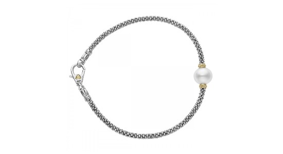 a mixed metal bracelet featuring a white pearl