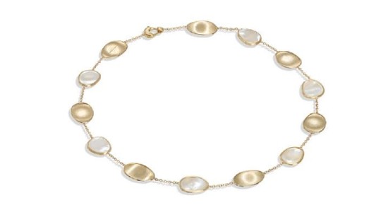 a yellow gold and mother of pearl necklace by Marco Bicego